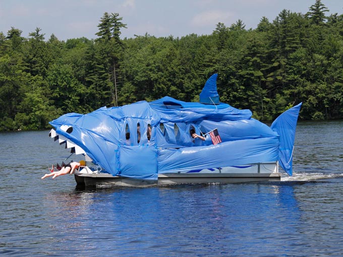 A pontoon boat decorated as a shark.