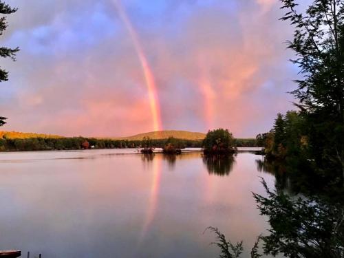 double rainbow over mountain